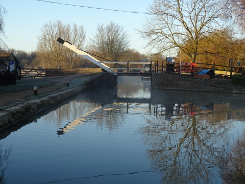 Thrupp, 26 Feb A still canal reflecting a lift bridge, blue sky and trees.